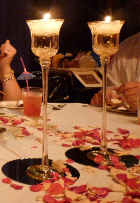 Floating candles and diamonds in pedestal votive holders